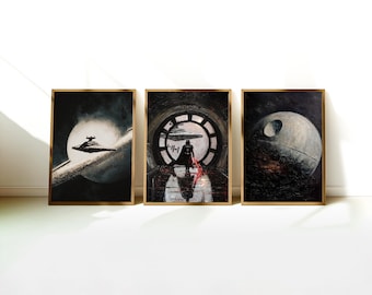 May include: Three framed Star Wars art prints. The first depicts a Star Destroyer in space, the second Darth Vader in a circular window, and the third the Death Star. Each print has a gold-colored frame.