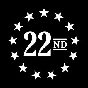 May include: A white circle with 22 stars around the edge and the number 22nd in the center.