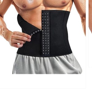 May include: A white ceramic mug with a black handle and the text "But First, Coffee" in a handwritten style. The mug is on a white surface. The mug is likely 11 ounces.