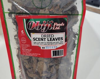 May include: A clear plastic bag filled with dried scent leaves. The bag has a red and green label with the text "Obji Foods Ltd." and "Dried Scent Leaves". The label also includes instructions for using the leaves, a batch number, and a barcode.