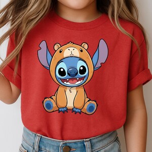 A red t-shirt with a cartoon image of a smiling, cartoon-like character wearing a bear costume.