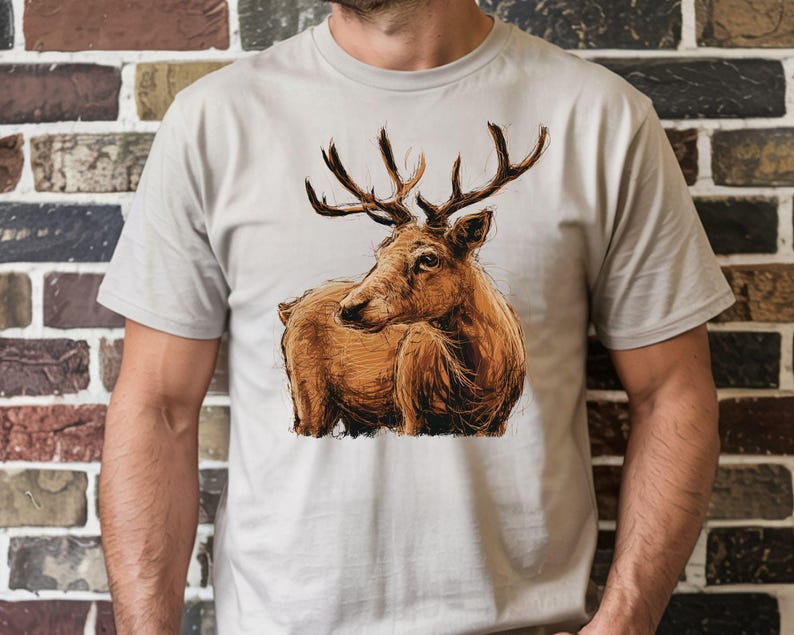 A man is wearing a white t-shirt with a printed image of a deer on it.