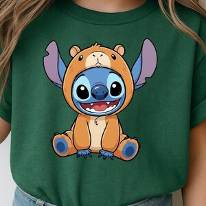 A green t-shirt with a cartoon character wearing a bear costume.