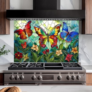 May include: A stained glass kitchen backsplash with a colorful butterfly design. The backsplash features three butterflies, one red, one yellow and blue, and one blue. The butterflies are surrounded by green leaves and flowers.