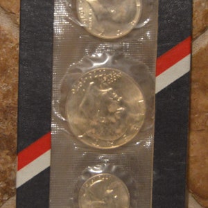 Zestaw dwusetnej rocznicy Stanów Zjednoczonych ~ Monety ~ Dolar ~ Pół dolara ~ Ćwierć dolara ~ Srebrny zestaw nieobiegowy ~ 1776 ~ 1976