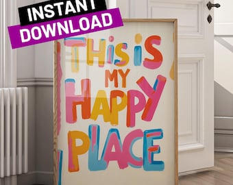 May include: A framed art print with the words "This is My Happy Place" in colorful, layered lettering. The print is in a wooden frame and has a white background. A banner that says "Instant Download" is in the upper left corner.