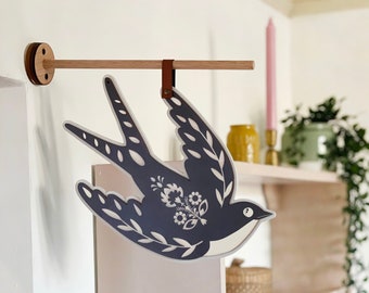 Off The Wall Bird Swinging Sign