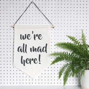 We're All Mad Here! banner - typographic flag, quote wall hanging