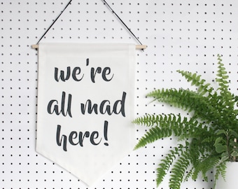 We're All Mad Here! banner - typographic flag, quote wall hanging