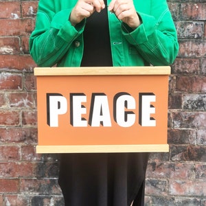 PEACE Hanging Poster Print In Terracotta