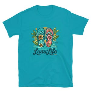May include: A turquoise blue t-shirt with a graphic of flip-flops with floral designs and the text "Luau Life" in a blue and white font.