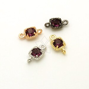 May include: Four square-shaped jewellery connectors with a purple gemstone in the centre. Each connector has a different metal finish: silver, gold, rose gold, and black.
