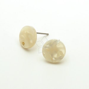 May include: A pair of white, round, stud earrings with a swirl pattern. The earrings have a silver post.