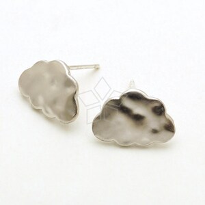 May include: A pair of silver cloud-shaped stud earrings. The earrings are made of a smooth, textured metal.
