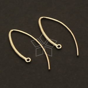 May include: Two gold-toned earring hooks with a textured finish. The hooks are designed to be used with a variety of earring styles.