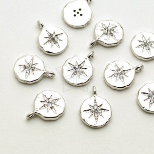 Puede incluir: Encantos de metal plateados con un diseño de estrella y diamantes de imitación transparentes. Cada encanto tiene un bucle para sujetarlo a joyas u otras manualidades.