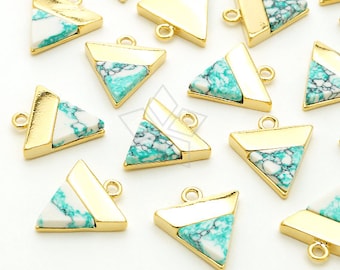 May include: Gold-plated triangle pendants with turquoise and white stone inlays. Each pendant has a small loop for attaching to a chain or other jewelry component. The pendants are geometric and modern.