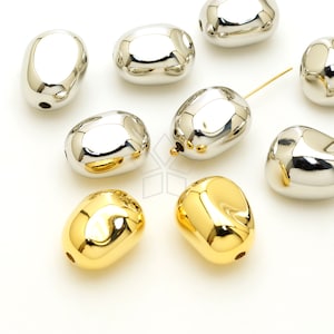 May include: A collection of smooth, oval-shaped beads in silver and gold finishes. The beads have a shiny, reflective surface and are perfect for jewellery making.