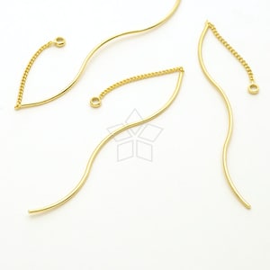 May include: Three gold-toned metal jewelry connectors with a wavy design and a small chain attached to each end.