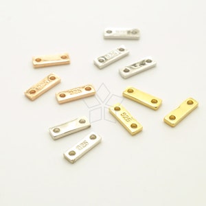 May include: Assortment of silver, gold, and rose gold metal connector bars with two holes. Each bar is stamped with "925" indicating sterling silver.