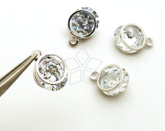 May include: Three silver-toned pendant charms with clear crystal stones. Each charm has a round shape with a single crystal stone in the center. The charms have a loop at the top for attaching to a necklace or bracelet.