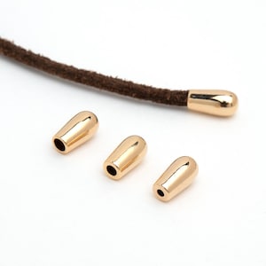 FE-073-GD / 2 pezzi - Terminali per cordini a forma di goccia in oro per cordini in pelle e creazione di gioielli. Punte in metallo per accessori fai da te con cordini in corda.