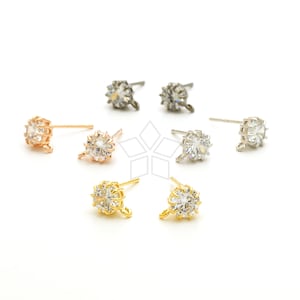 May include: Six pairs of earring findings with a clear crystal stone in the center. The findings are available in gold, silver, and rose gold.