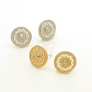 May include: Three pairs of earrings with a circular design. The earrings are made of metal and have a delicate, intricate pattern. Two pairs are silver and one pair is gold.