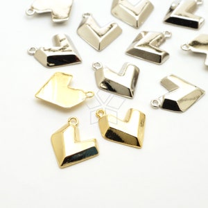 May include: A collection of gold and silver heart-shaped charms with a geometric design. The charms have a loop at the top for attaching to jewelry or other crafts.