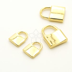May include: Four gold-colored padlock charms of varying sizes. The charms are made of metal and have a shiny finish.