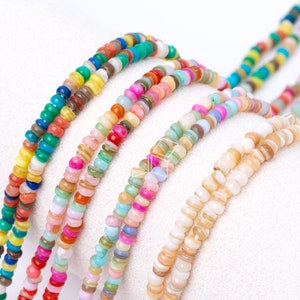 May include: Assortment of colorful beaded necklaces with various patterns and colors, including pink, blue, green, yellow, and white.