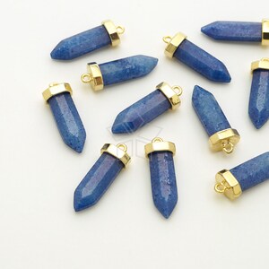 May include: Ten blue gemstone pendants with gold-toned metal caps and loops. The gemstones are faceted and have a pointed shape.