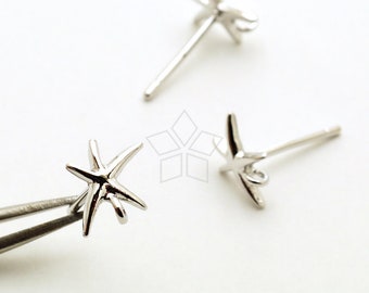 May include: Three silver starfish earring charms with a loop for attaching to a post. The charms are on a white background.