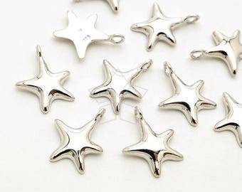 May include: A collection of silver-toned metal star-shaped charms. The charms are all the same size and shape, but they have different finishes. Some are shiny, while others are matte.