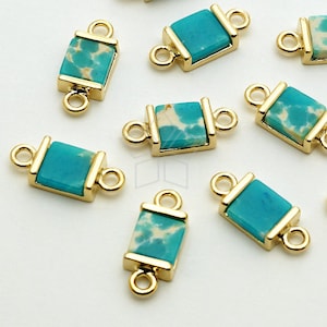 May include: A set of ten gold-toned metal connector charms with turquoise and white stone inlays. Each charm has two loops for attaching to jewelry.