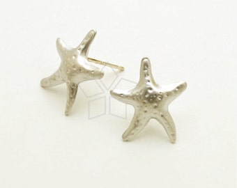 May include: A pair of silver starfish stud earrings. The starfish are textured and have a slightly raised design.