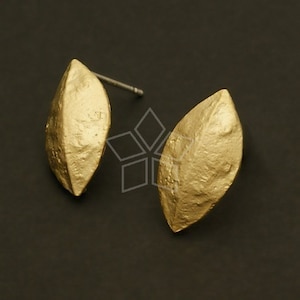 May include: A pair of gold leaf-shaped earrings with a textured surface.