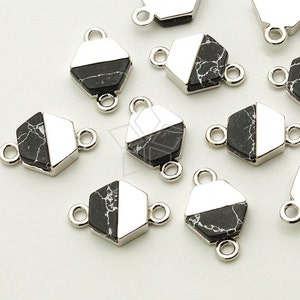 May include: A set of black and white marble hexagon charms with silver jump rings. The charms are perfect for adding a touch of elegance to jewelry projects.