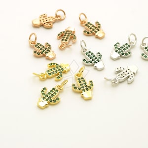 May include: A collection of gold, silver, and rose gold cactus charms with green crystal accents. The charms are perfect for adding a touch of whimsy to jewelry.
