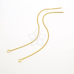 Puede incluir: Dos extensores de pendientes de cadena dorada con pequeños bucles en los extremos. Los extensores están hechos de una cadena delicada.