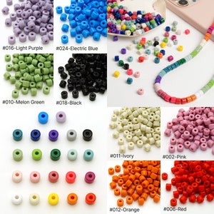 May include: Assortment of small, round plastic beads in various colours, including light purple, electric blue, melon green, black, ivory, pink, orange, and red. Each colour is labelled with a number and colour name.