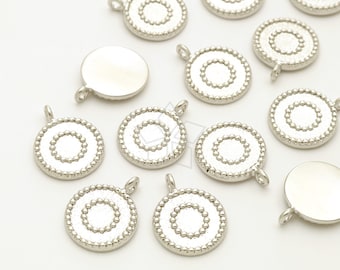 May include: Silver-toned metal charms with a circle design. Each charm has a loop for attaching to jewelry or other crafts.