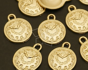 May include: Gold-toned metal clock face charms with Roman numeral markings and a detailed clock hand design. The charms have a loop at the top for attaching to jewellery or other crafts.