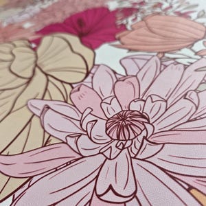 May include: Close-up of a pink and white floral print with a detailed design. The flower has a pink center and white petals with a delicate outline.