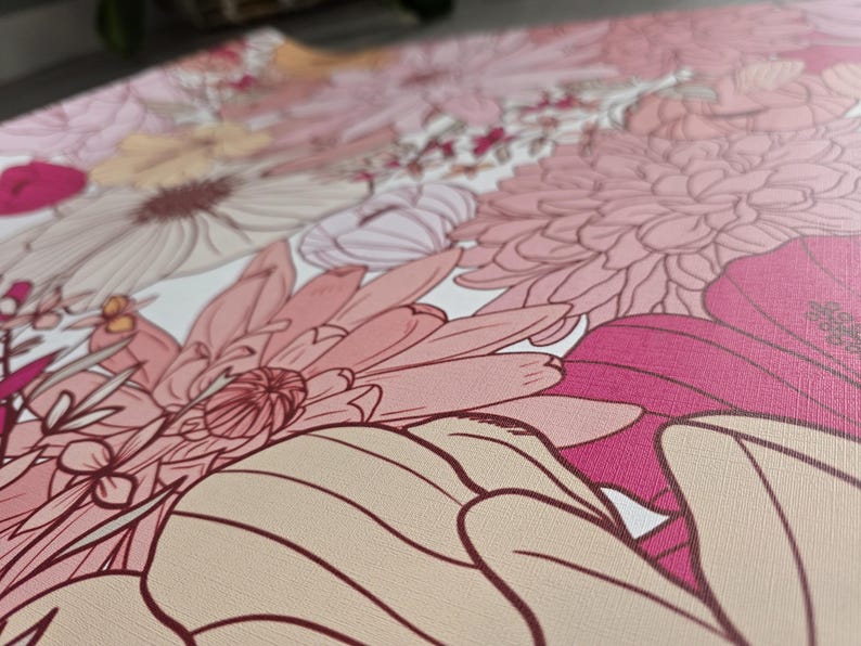 May include: A close-up of a floral print fabric with pink, white, and red flowers. The fabric has a textured surface and a delicate floral pattern.