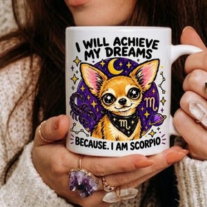 May include: A white ceramic mug featuring a graphic of a tan chihuahua wearing a black bandana with a Scorpio symbol. The design includes a purple circular background with stars, a crescent moon, a scorpion, and the text I WILL ACHIEVE MY DREAMS BECAUSE. I AM SCORPIO.