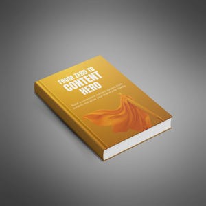 May include: A hardcover book titled "FROM ZERO TO CONTENT HERO" with a gold cover and white text. The cover features an orange cape design. The book's subtitle reads, "Build a consistent content system from scratch and grow your brand with clarity."