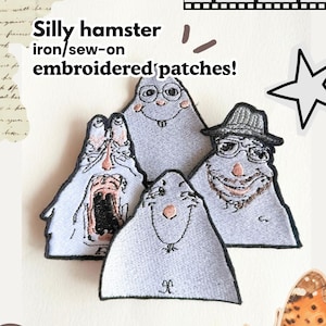 May include: Four light grey embroidered patches featuring cartoon hamster characters with distinct facial expressions, including one wearing a hat and glasses, one with a wide-open mouth, and one with round glasses. Text reads: Silly hamster iron/sew-on embroidered patches!
