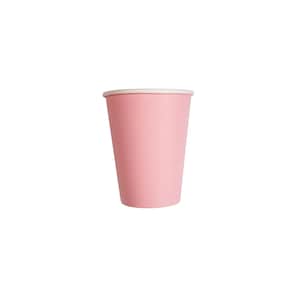May include: A light pink paper cup with a white rim. The cup is cylindrical and appears empty, set against a plain white background. The cup is a solid color with a smooth texture.