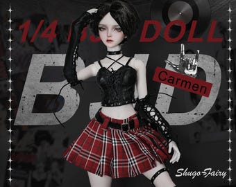 May include: A 1/4 scale doll named Carmen, dressed in a black corset top, a red plaid skirt, and black arm warmers. The doll has short black hair and wears a choker and wrist cuffs. The background includes the word "BAD" and a vinyl record.